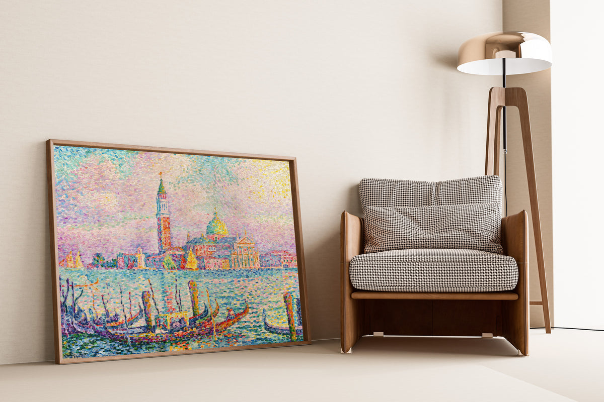 Framed art print of Saint-Georges, Sunset, Venice by Paul Signac, leaning against a wall beside an armchair and a floor lamp