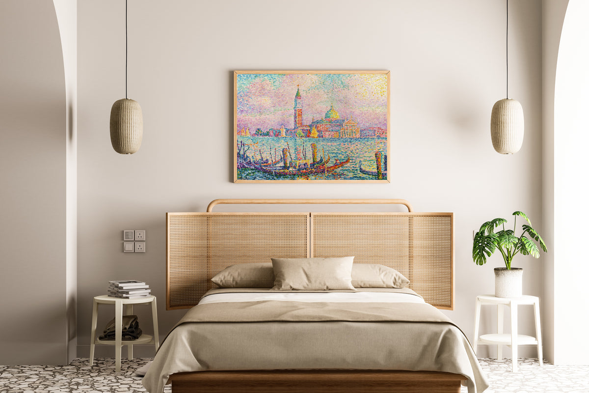 Framed art print of Saint-Georges, Sunset, Venice by Paul Signac, above a cane-headboard bed