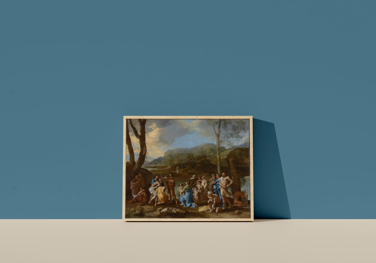Framed art print of Saint John Baptizing in the River Jordan by Nicolas Poussin, in a light wood frame leaning on a blue wall