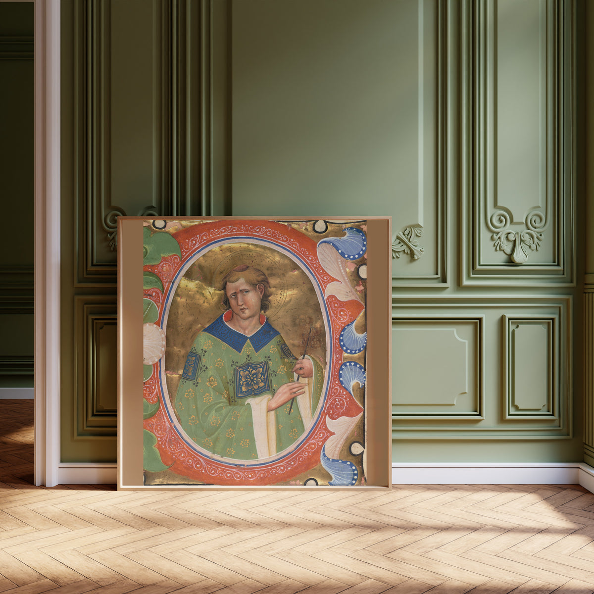Framed art print of Saint Lawrence by Master of the Murano Gradual, leaning against olive-green panelling on a herringbone floor