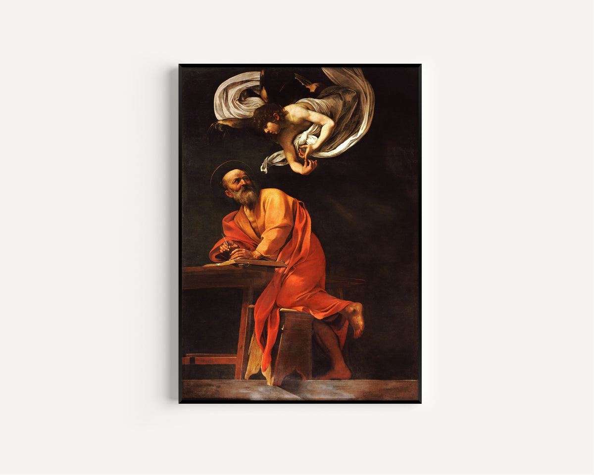 Framed art print of Saint Matthew and the angel by Caravaggio, in a slim black frame on a plain white wall