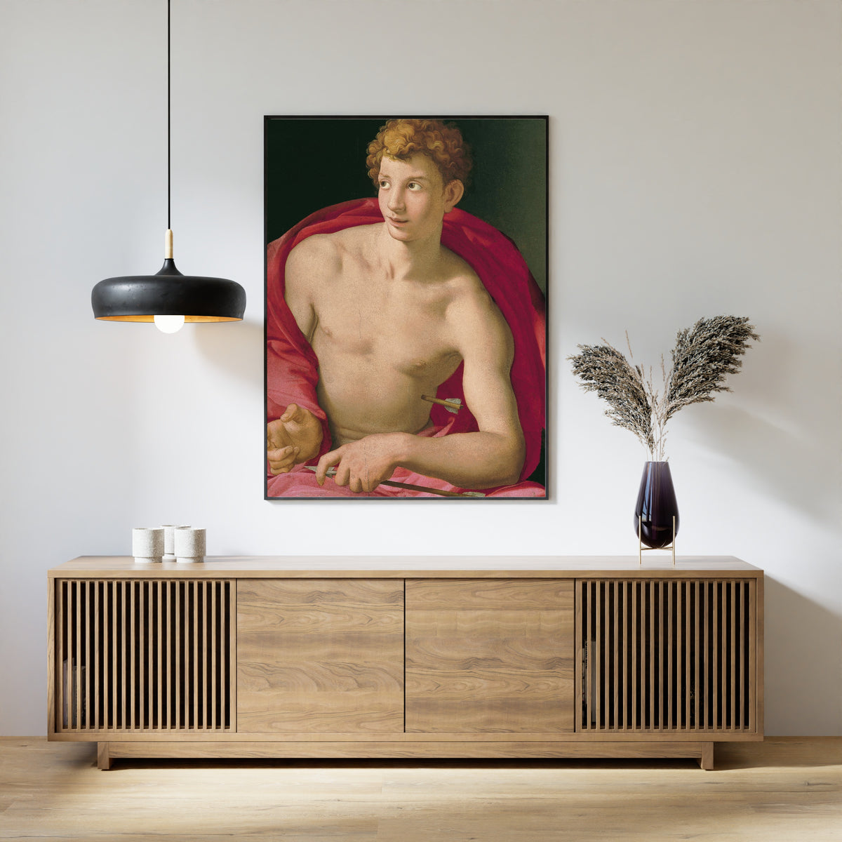 Framed art print of Saint Sebastian by Bronzino, above a slatted wood sideboard