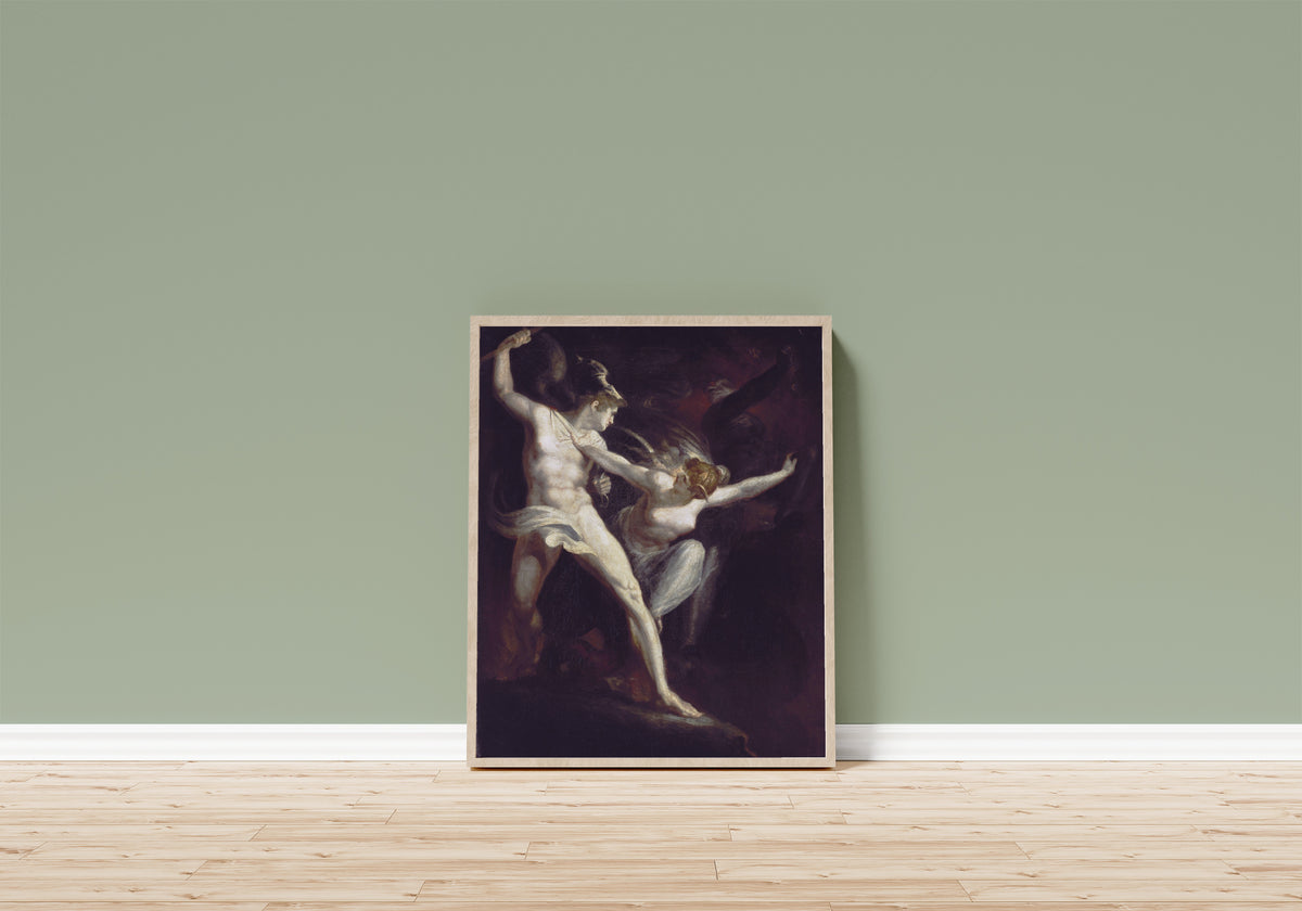 Framed art print of Satan and Death, Separated by Sin by Henry Fuseli, in a light wood frame leaning on a sage green wall above a wooden floor