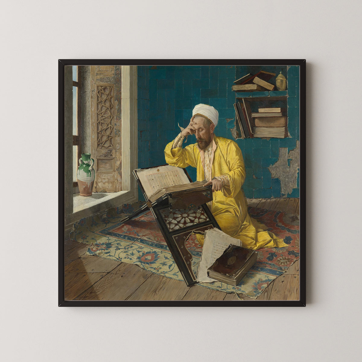 Scholar with Quran by Osman Hamdi Bey — in a black frame on a pale wall