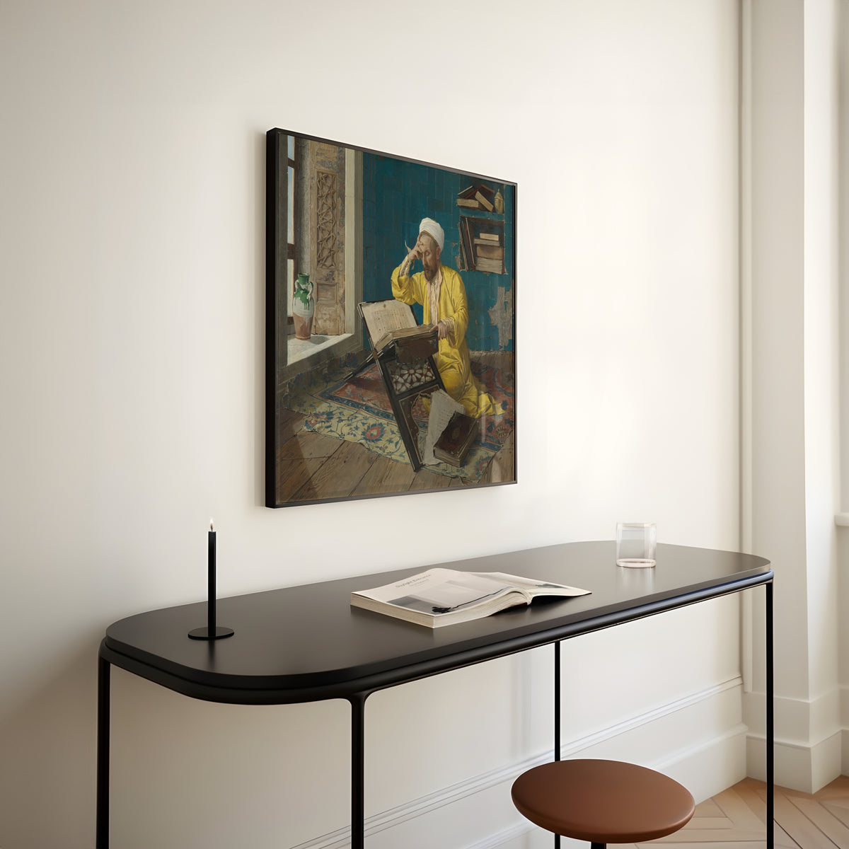 Scholar with Quran by Osman Hamdi Bey — framed above a slim black console table
