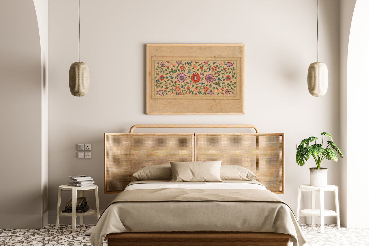 Framed art print of Scrolling Floral Vines by Fayzullah, above a cane-headboard bed