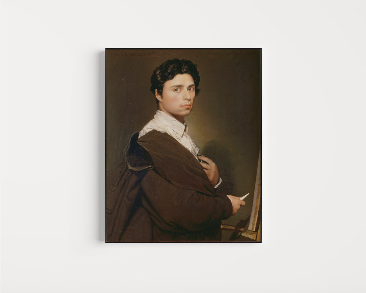 Framed art print of Self-Portrait Aged 24 by Jean-Auguste-Dominique Ingres, in a slim black frame on a plain white wall