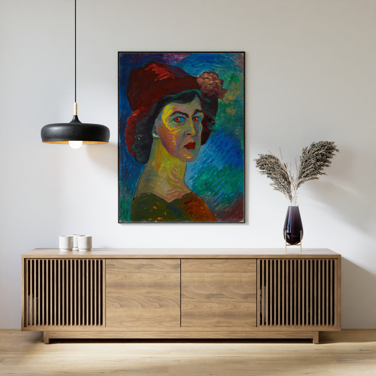 Self-Portrait I by Marianne von Werefkin — framed above a slatted wood sideboard