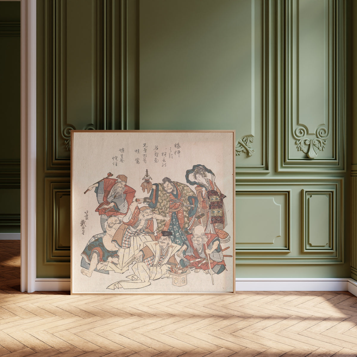 Framed art print of Seven Gods of Good Fortune by Katsushika Hokusai, leaning against olive-green panelling on a herringbone floor