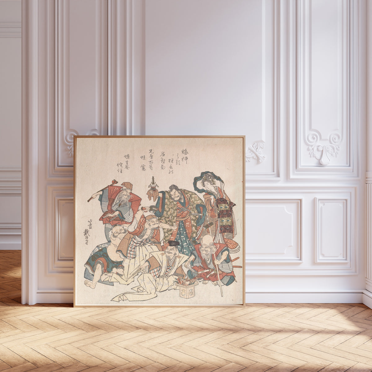 Framed art print of Seven Gods of Good Fortune by Katsushika Hokusai, leaning against pale pink panelling on a herringbone floor