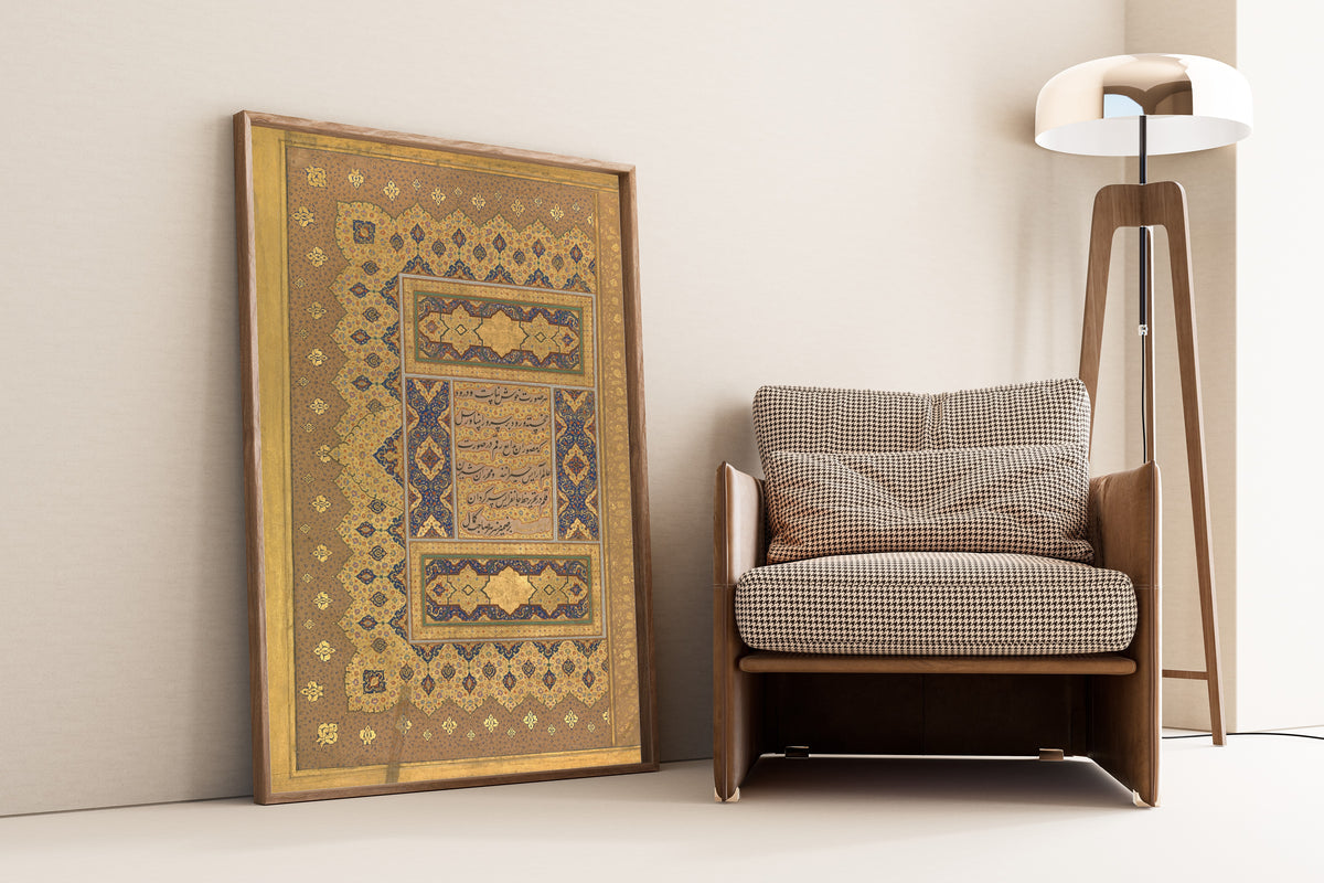 Framed art print of Shah Jahan Album: 'Unwan (Gold Palmette Margin) by Mir 'Ali Haravi, leaning against a wall beside an armchair and a floor lamp
