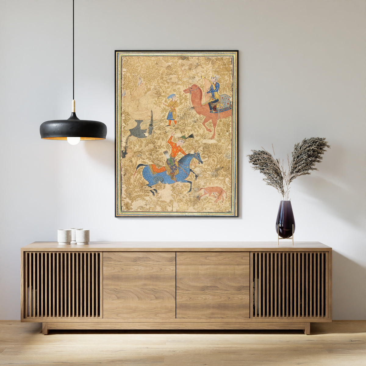 Framed art print of Shahnama: Bahram Gur and Azada, above a slatted wood sideboard