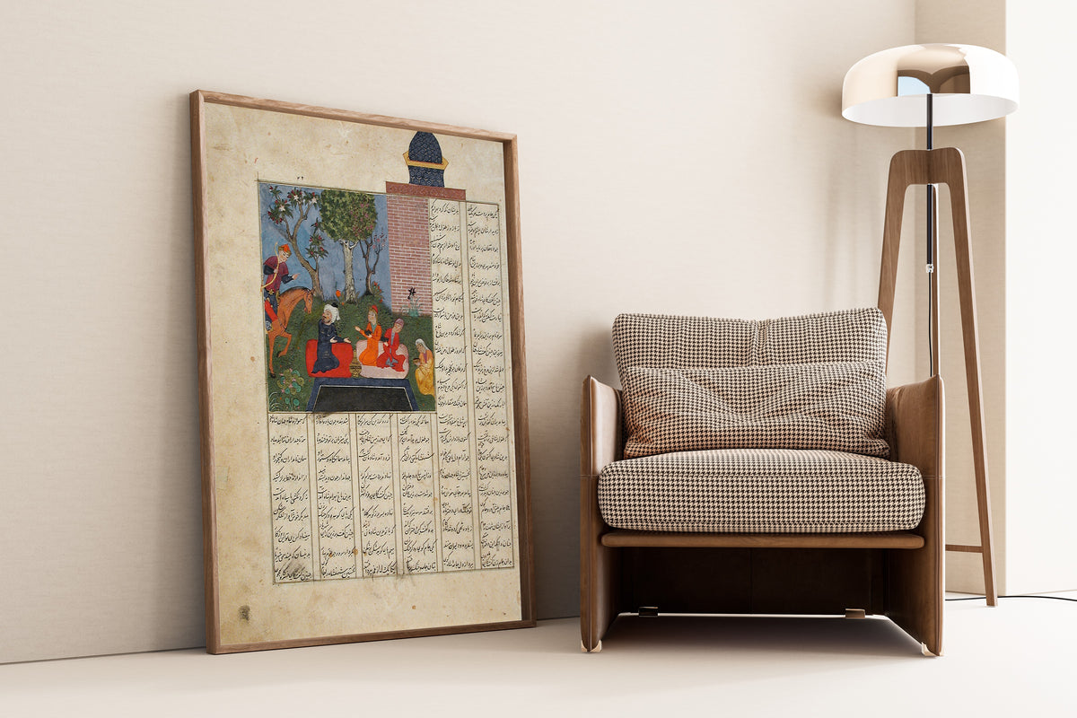 Framed art print of Shahnama: Bahram Gur and the Farmer's Daughters, leaning against a wall beside an armchair and a floor lamp