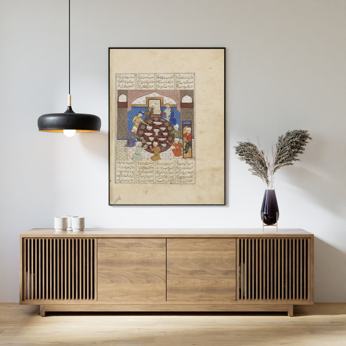Framed art print of Shahnama: Hormuz Forces His High Priest to Eat Poisoned Food, above a slatted wood sideboard