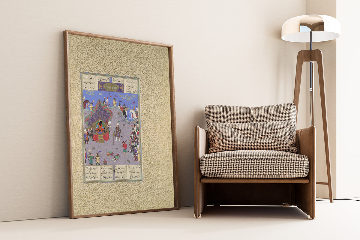 Framed art print of Shahnama of Shah… by Mir Musavvir (attributed) and Qasim ibn Ali (attributed), leaning against a wall beside an armchair and a floor lamp