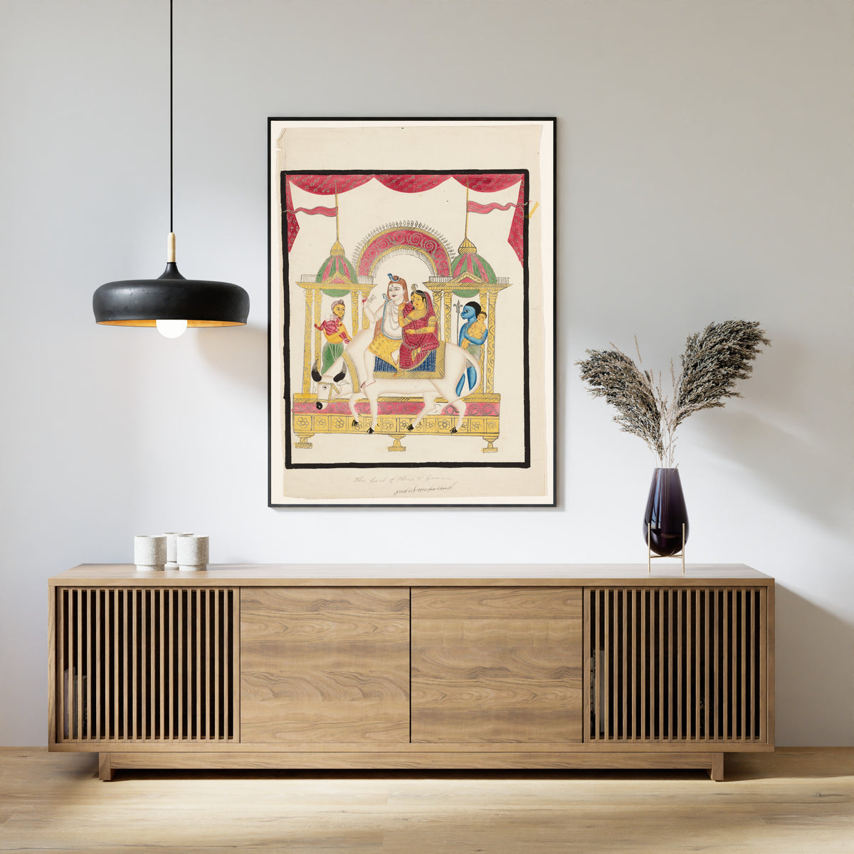 Framed art print of Shiva and Parvati on Nandi with Kartikeya and Ganesha by Kalighat painter, above a slatted wood sideboard