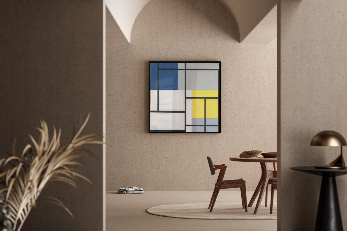 Framed art print of Simultaneous Composition by Theo van Doesburg, in a sunlit dining corner