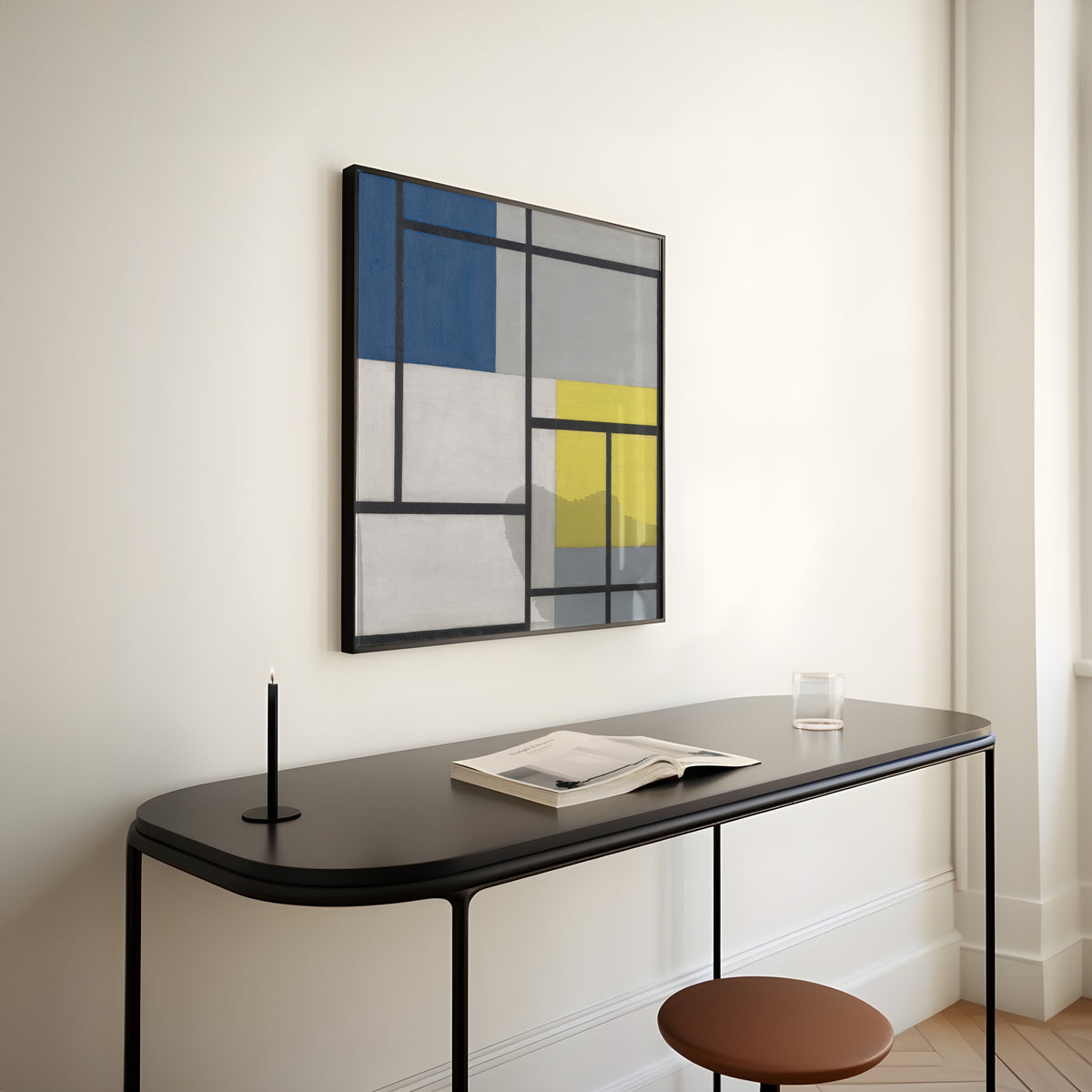 Framed art print of Simultaneous Composition by Theo van Doesburg, above a slim black console table