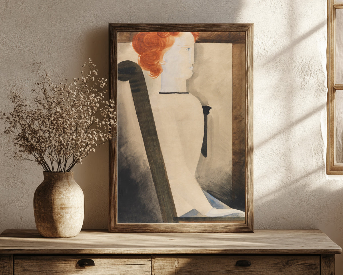 Framed art print of Sitzende by Oskar Schlemmer, in a dark wood frame leaning on a rustic console beside dried flowers