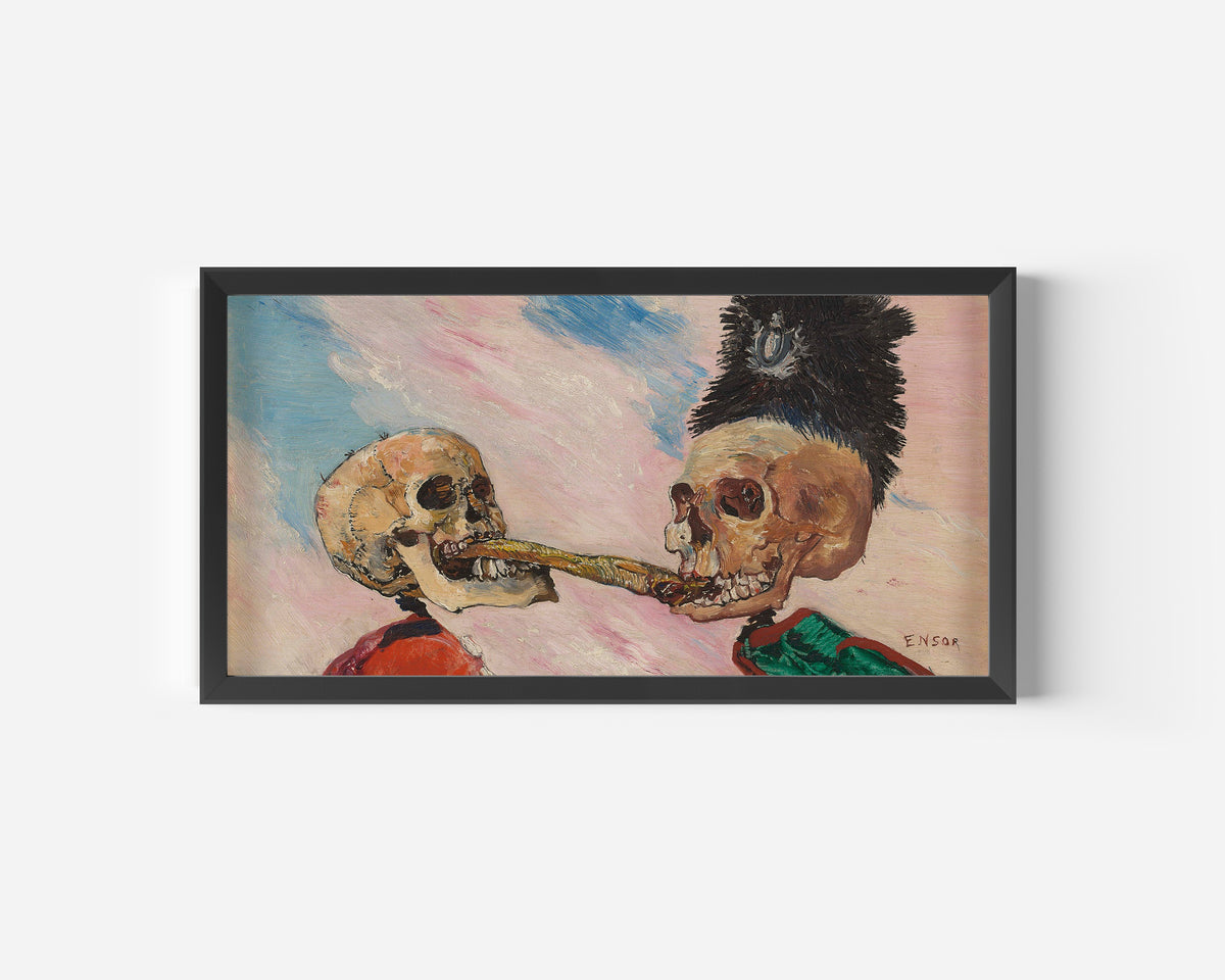 Framed art print of Skeletons Fighting over a Pickled Herring by James Ensor, in a wide black frame on a plain white wall