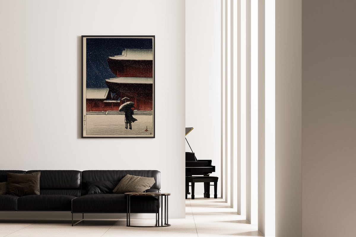 Framed art print of Snow at Zojoji Temple (1922) by Kawase Hasui, on the wall of a minimal living room