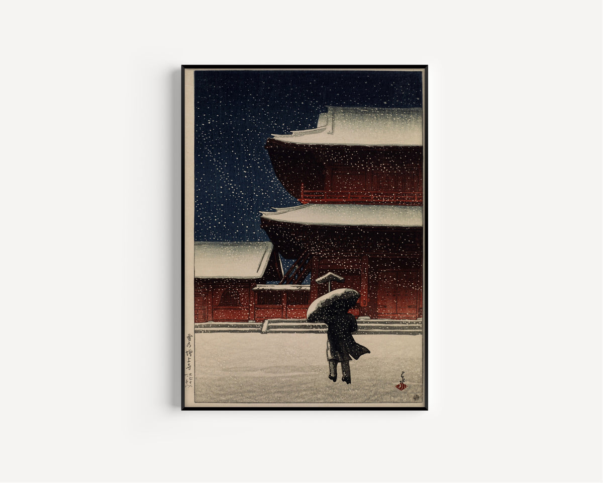 Framed art print of Snow at Zojoji Temple (1922) by Kawase Hasui, in a slim black frame on a plain white wall