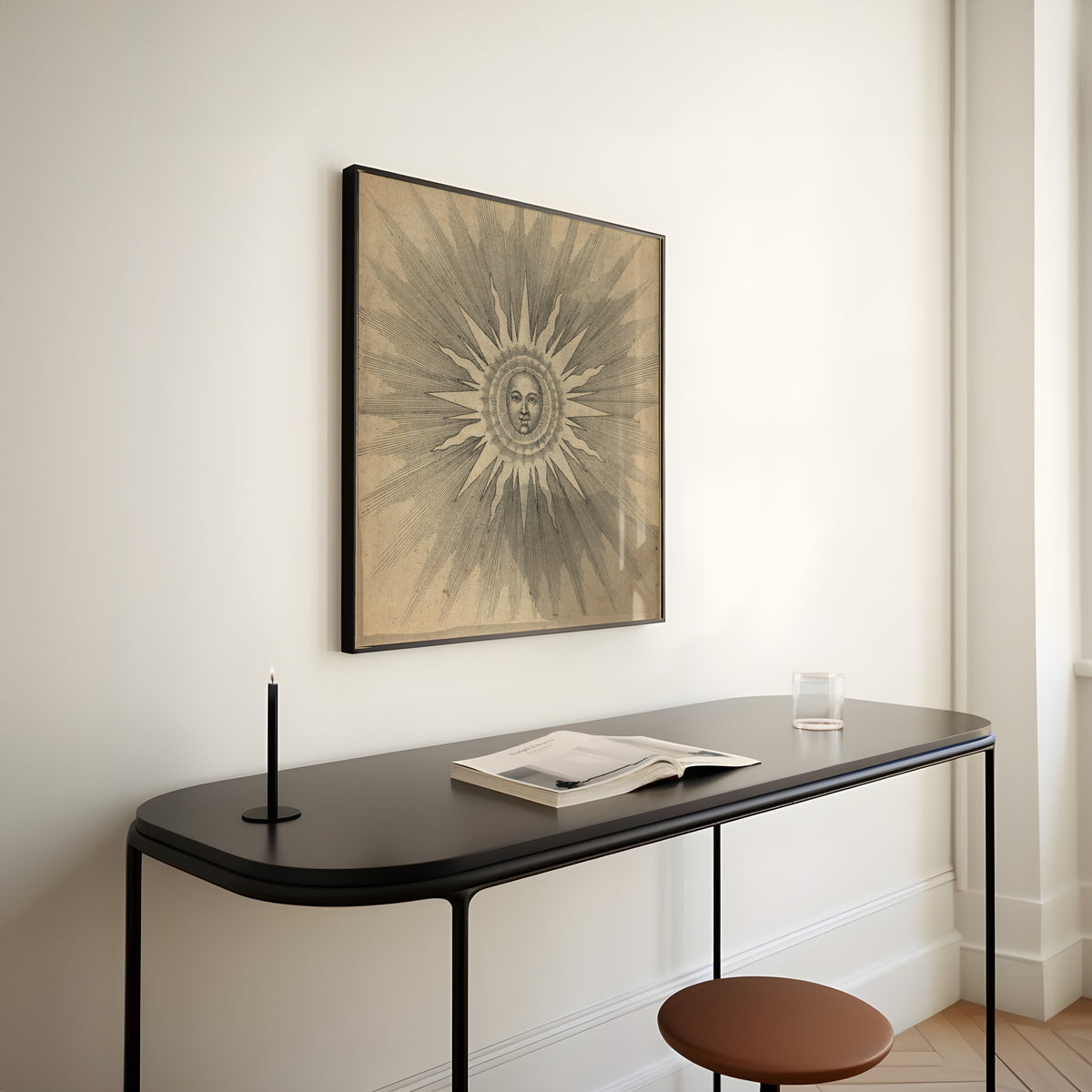 Framed art print of Solis: the Sun with a Face (Utriusque Cosmi, p. 19) by Robert Fludd, above a slim black console table