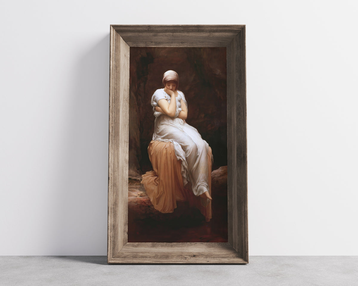 Framed art print of Solitude by Frederic Leighton, in a wide wooden frame leaning against a concrete wall