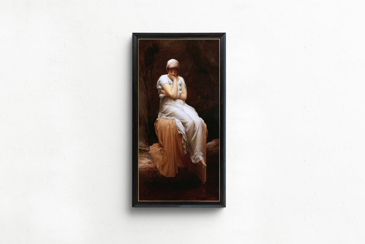 Framed art print of Solitude by Frederic Leighton, in a slim black frame on a plain white wall