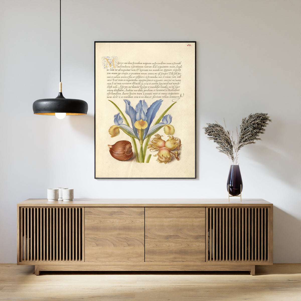 Framed art print of Spanish Chestnut, English Iris, and European Filbert by Joris Hoefnagel, above a slatted wood sideboard
