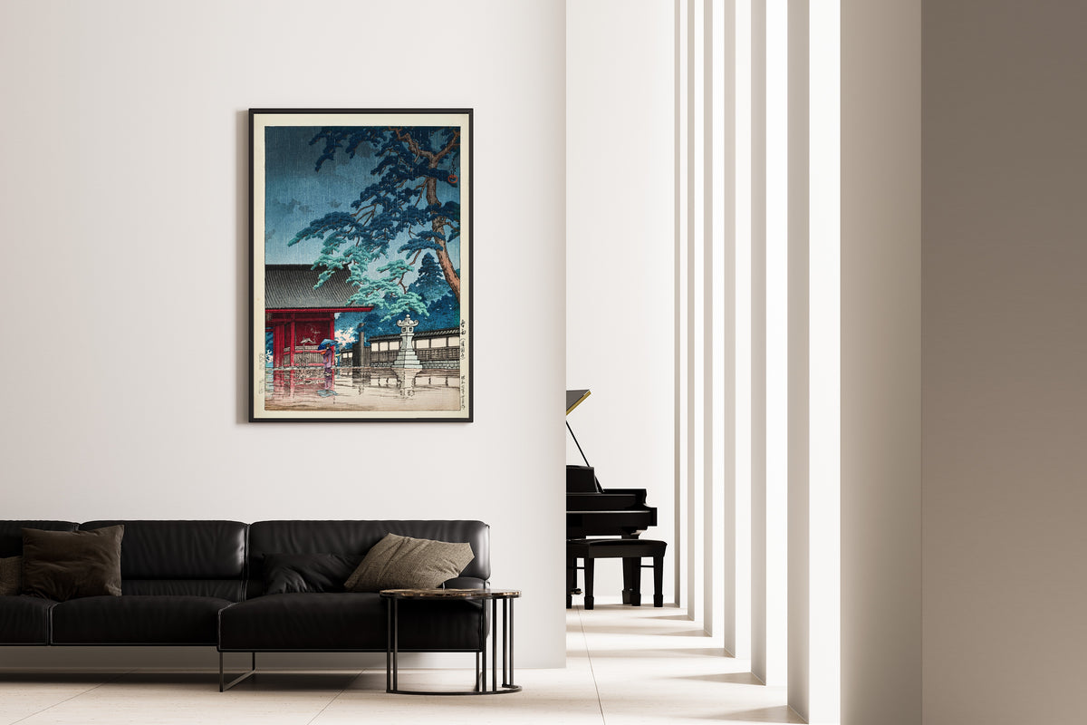 Framed art print of Spring Rain at Gokokuji Temple by Kawase Hasui, on the wall of a minimal living room