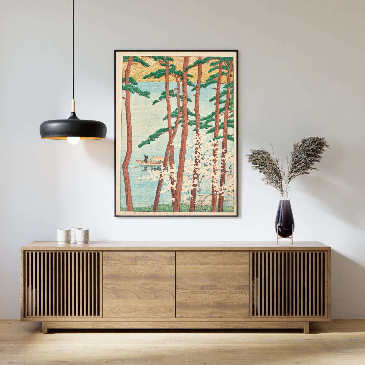 Framed art print of Spring in Arashiyama by Kawase Hasui, above a slatted wood sideboard