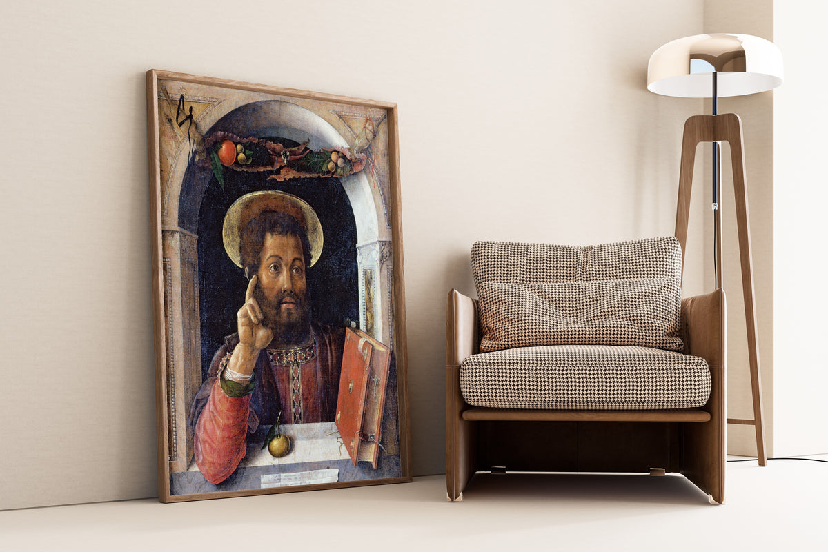 Framed art print of St Mark the Evangelist by Andrea Mantegna, leaning against a wall beside an armchair and a floor lamp