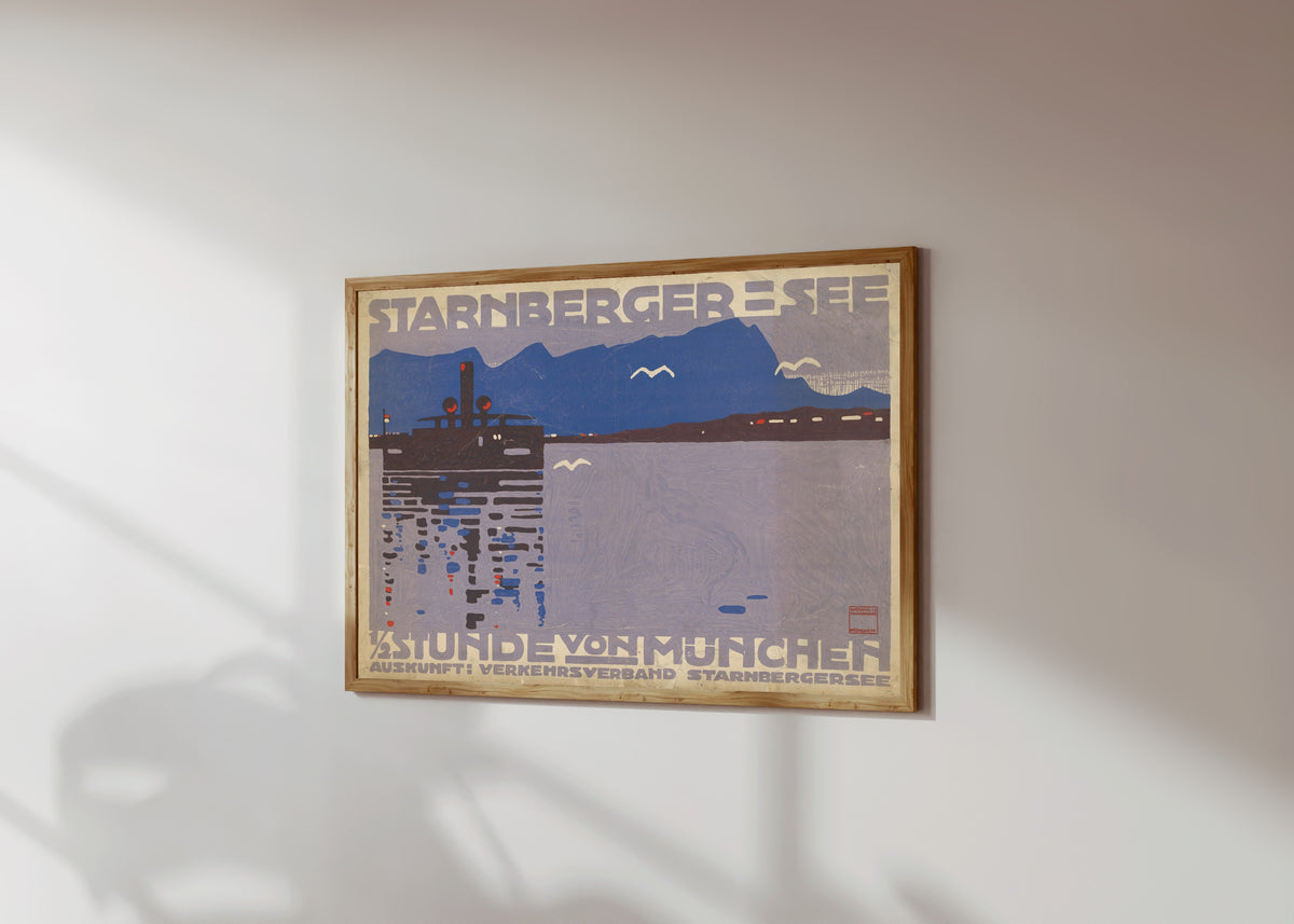 Framed art print of Starnberger See: ½ Stunde von München by Ludwig Hohlwein, in a light wood frame on a sunlit white wall, seen at a slight angle
