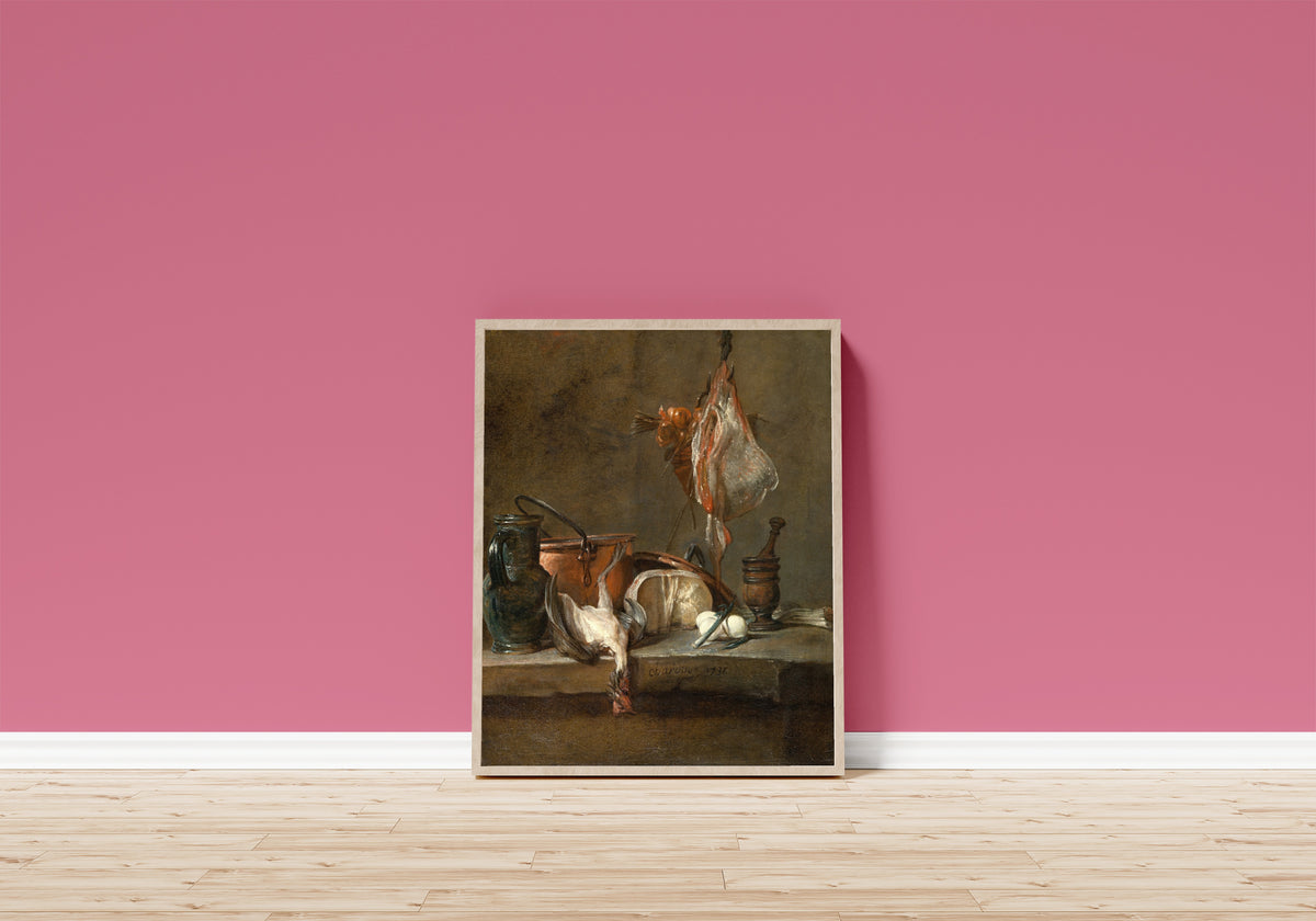 Framed art print of Still Life with Ray and Basket of Onions by Jean-Siméon Chardin, in a light wood frame leaning on a pink wall above a wooden floor
