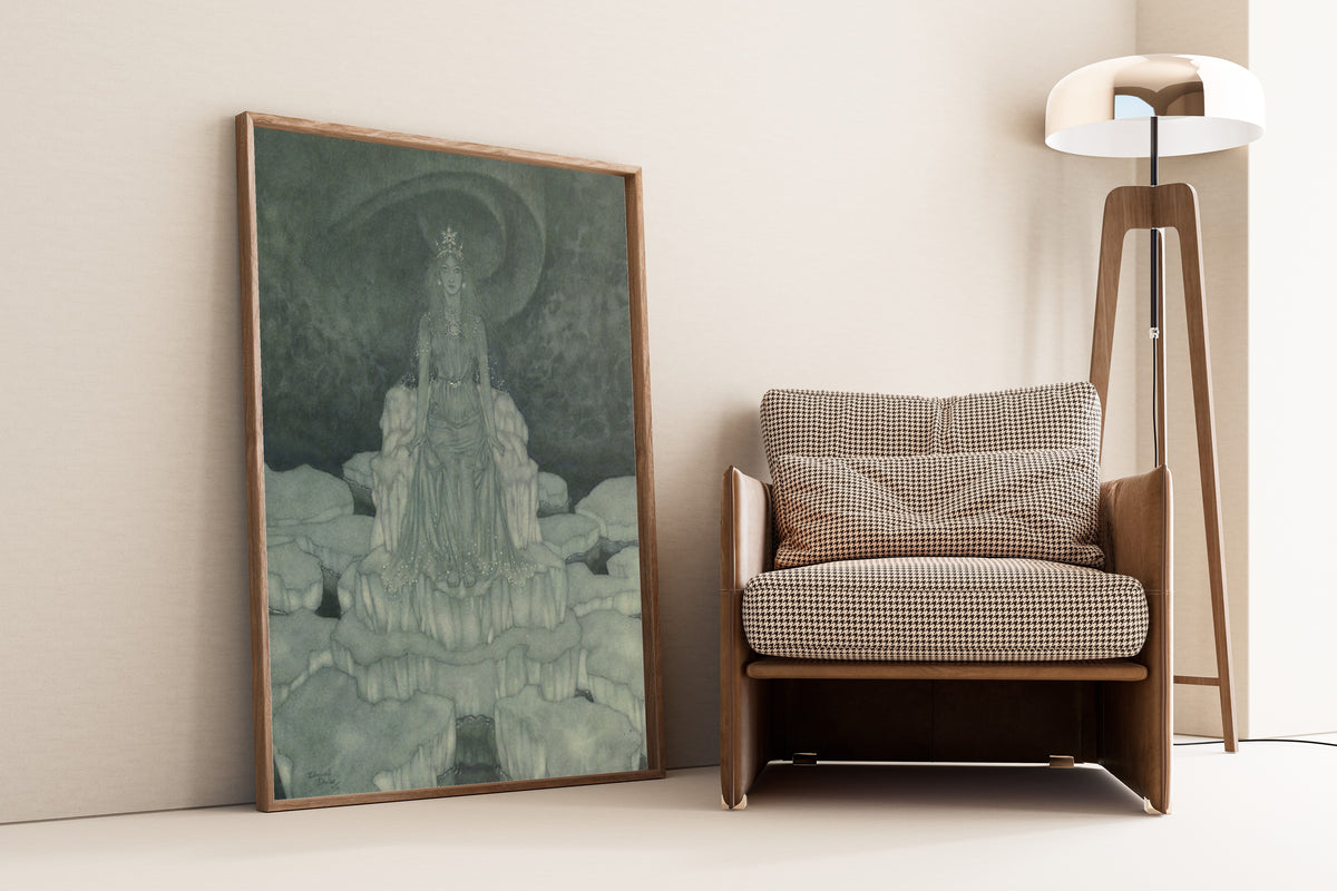 Framed art print of Stories from Hans Andersen: The Snow Queen Sat in the Very… by Edmund Dulac, leaning against a wall beside an armchair and a floor lamp