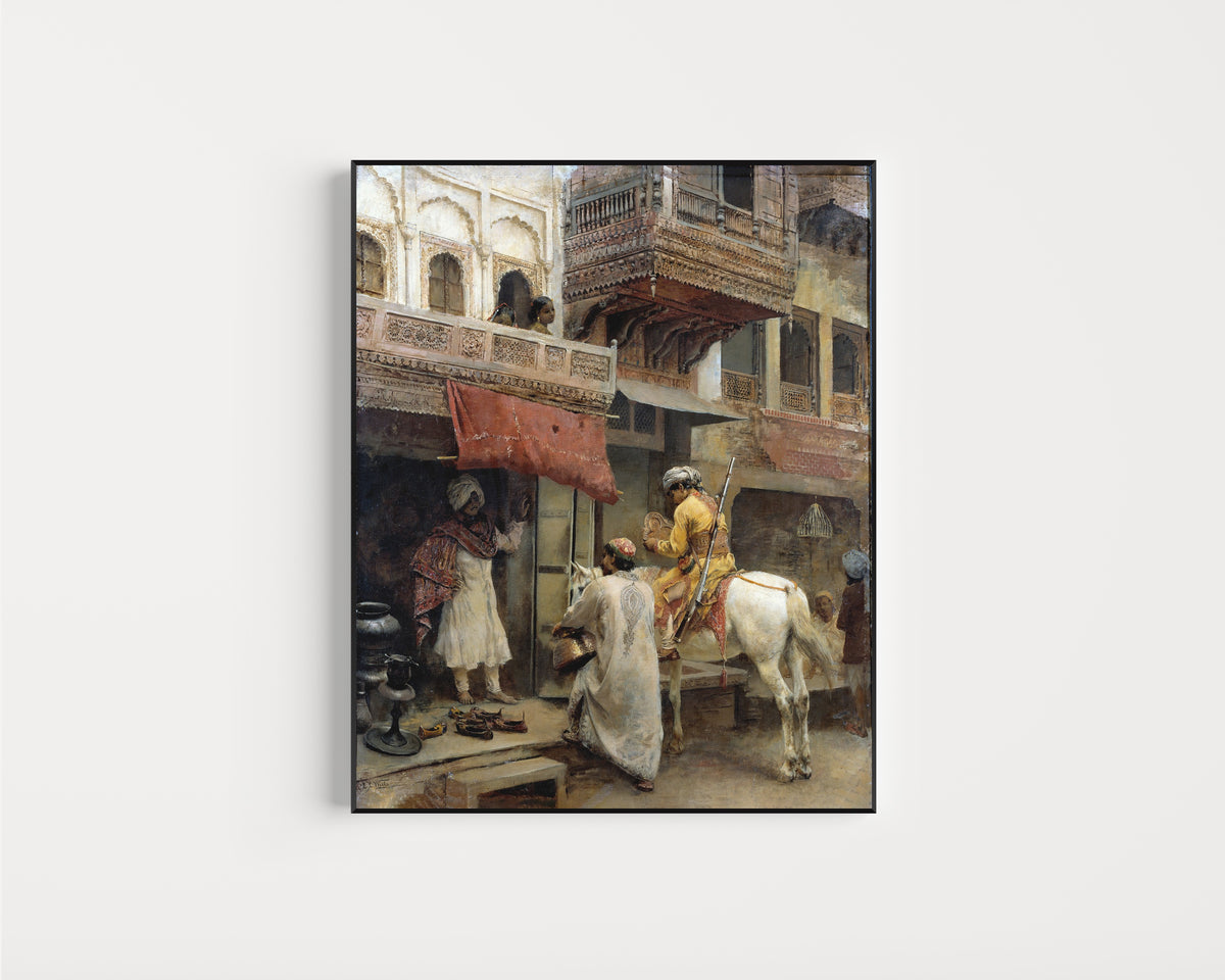 Framed art print of Street Scene in India by Edwin Lord Weeks, in a slim black frame on a plain white wall