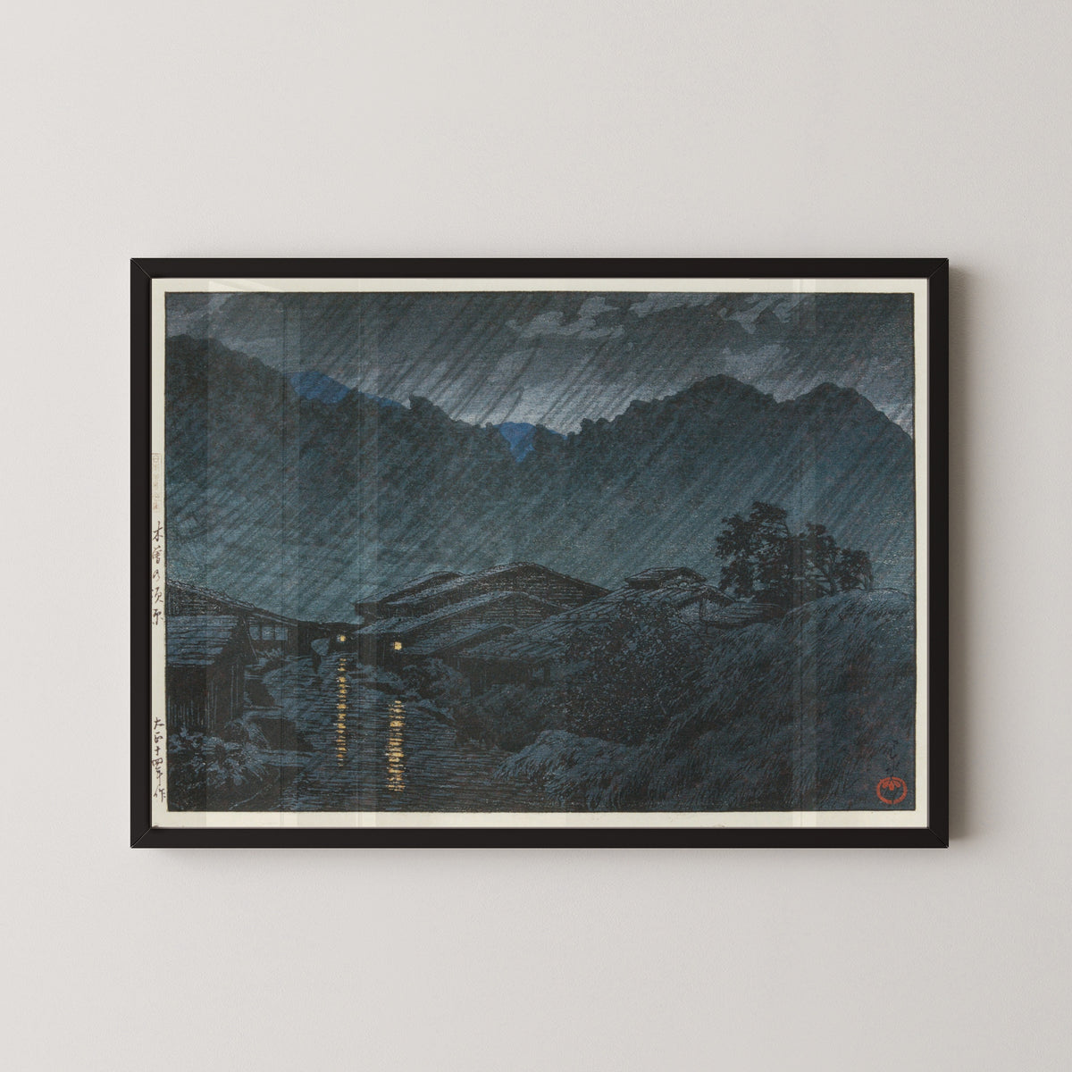 Framed art print of Suhara, Kiso by Kawase Hasui, in a black frame on a pale wall