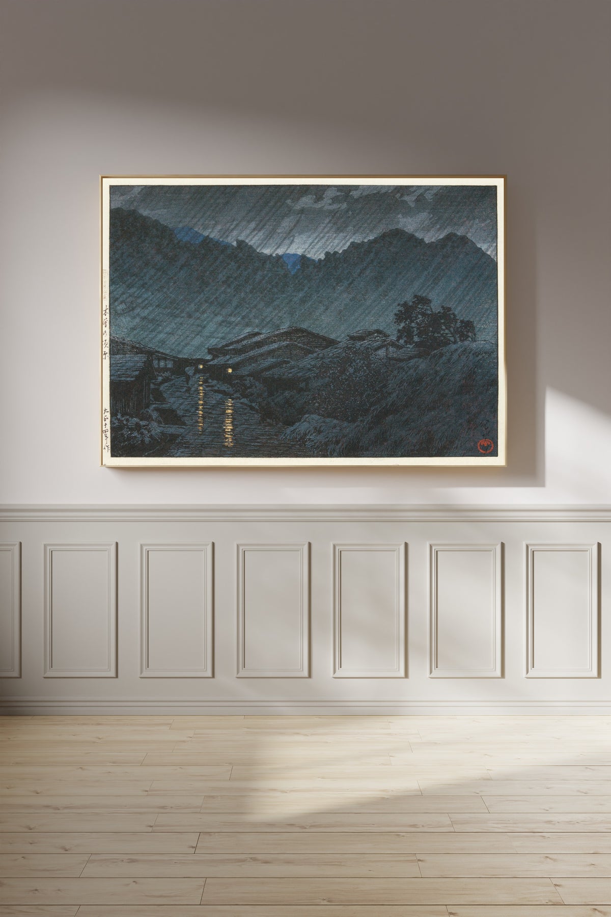 Framed art print of Suhara, Kiso by Kawase Hasui, on a panelled wall in afternoon light