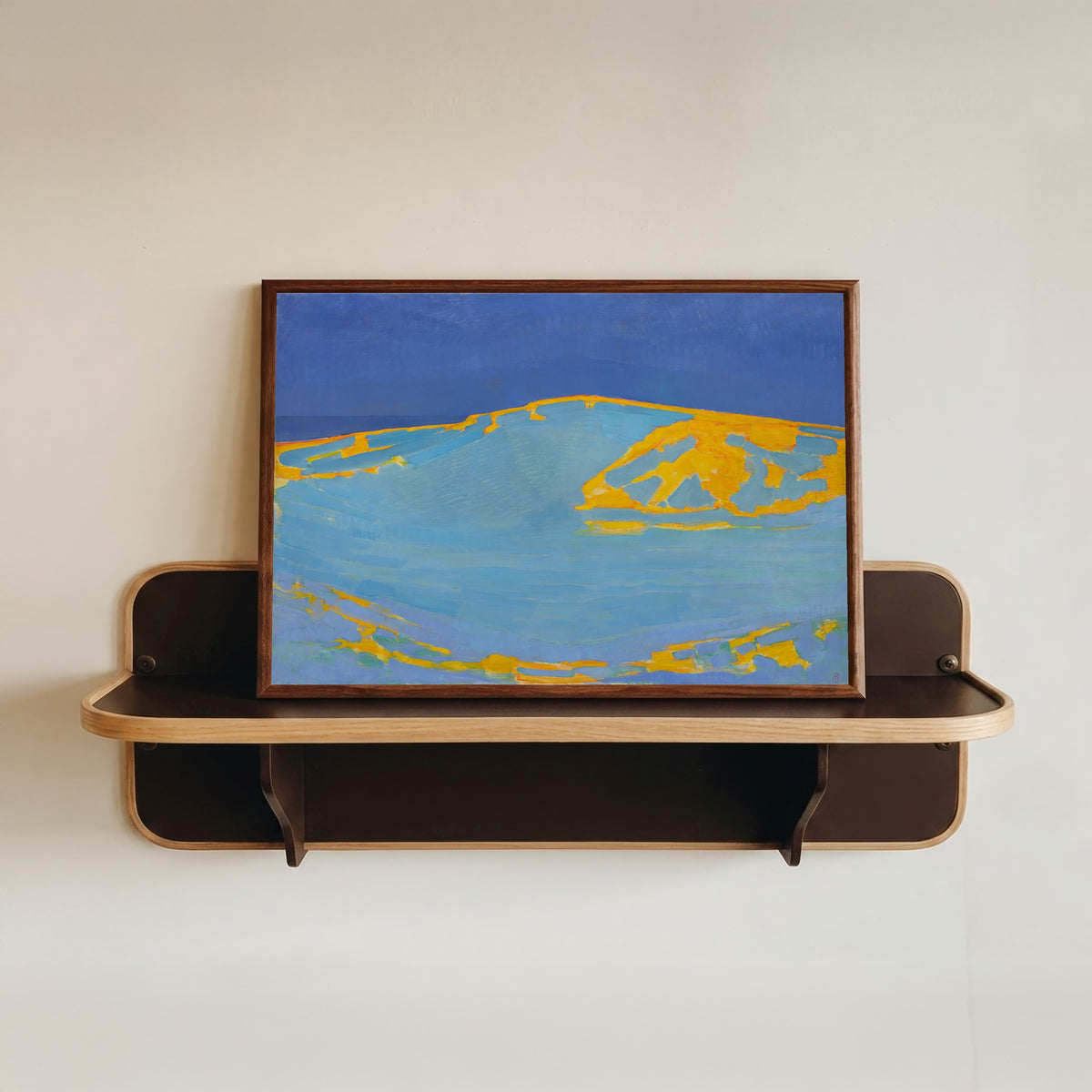 Framed art print of Summer, Dune in Zeeland by Piet Mondrian, in a dark wood frame resting on a wall shelf