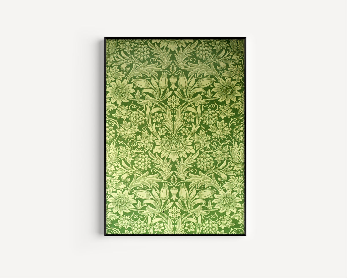 Framed art print of Sunflower by William Morris, in a slim black frame on a plain white wall