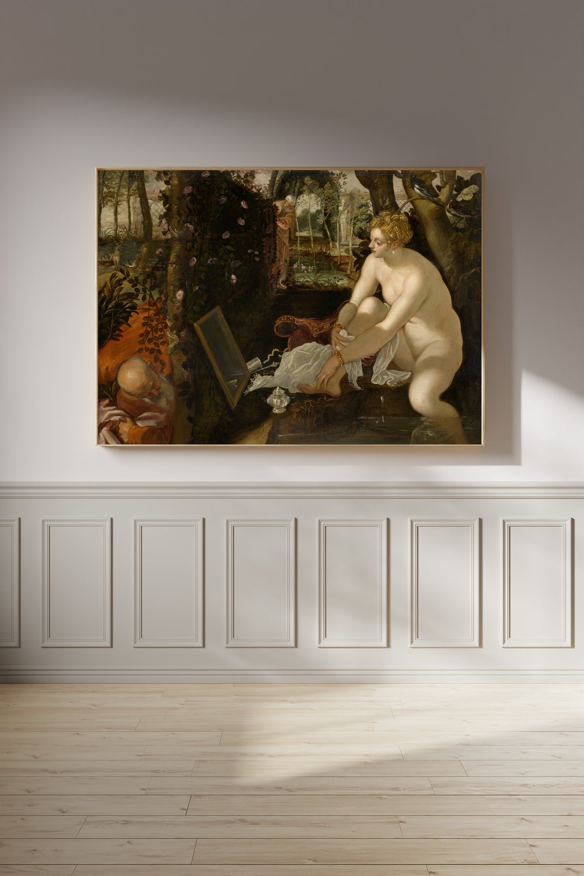 Framed art print of Susanna and the Elders by Tintoretto, on a panelled wall in afternoon light