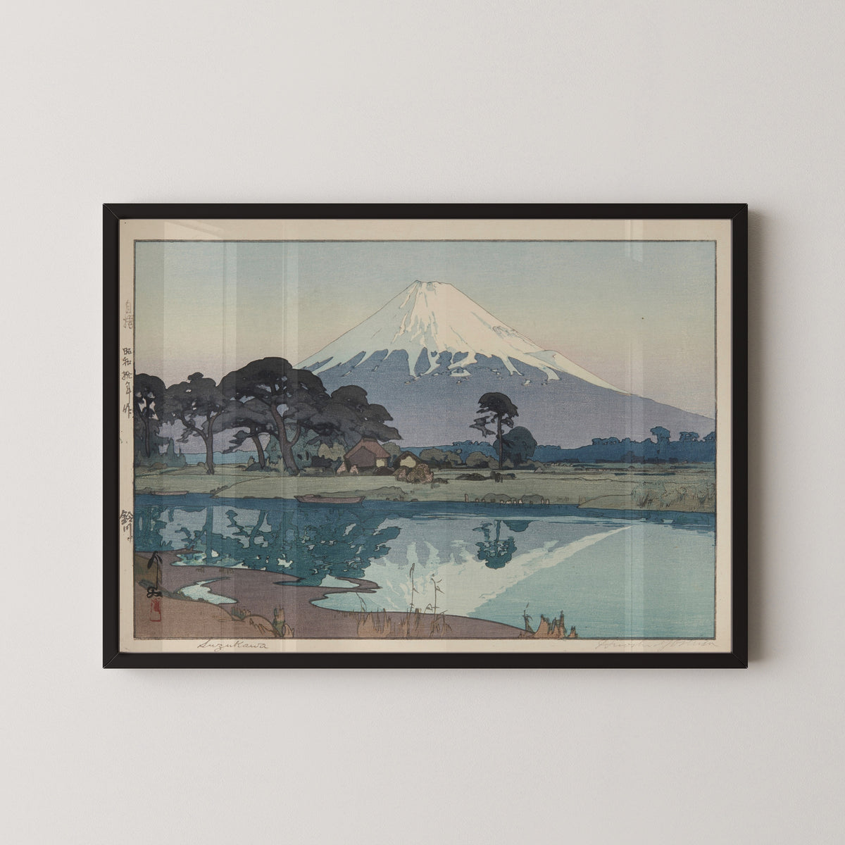 Framed art print of Suzukawa by Hiroshi Yoshida, in a black frame on a pale wall
