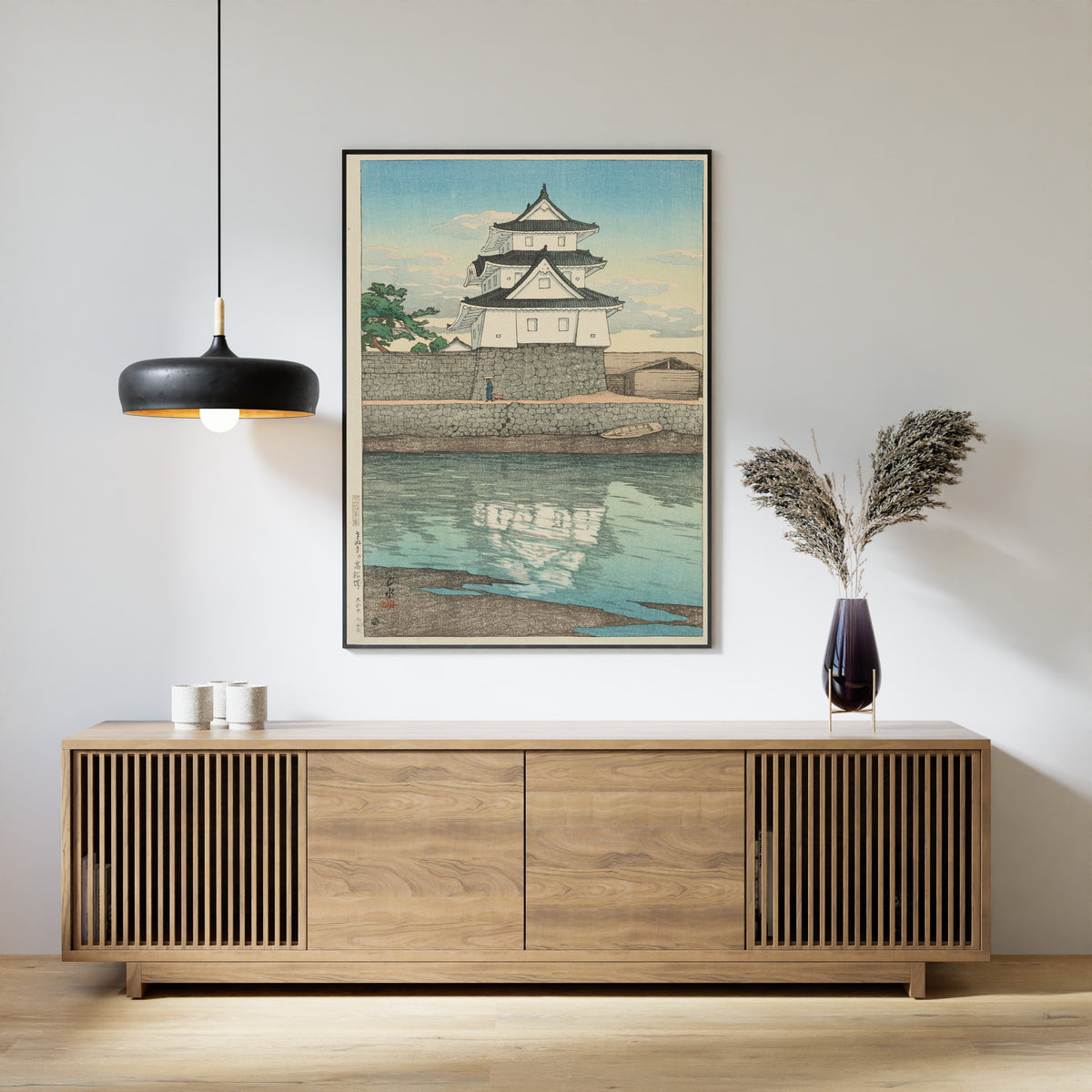 Framed art print of Takamatsu Castle in Sanuki by Kawase Hasui, above a slatted wood sideboard