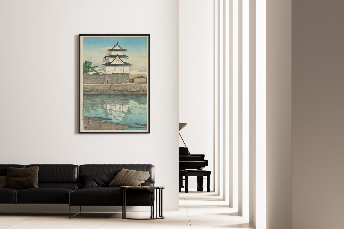 Framed art print of Takamatsu Castle in Sanuki by Kawase Hasui, on the wall of a minimal living room
