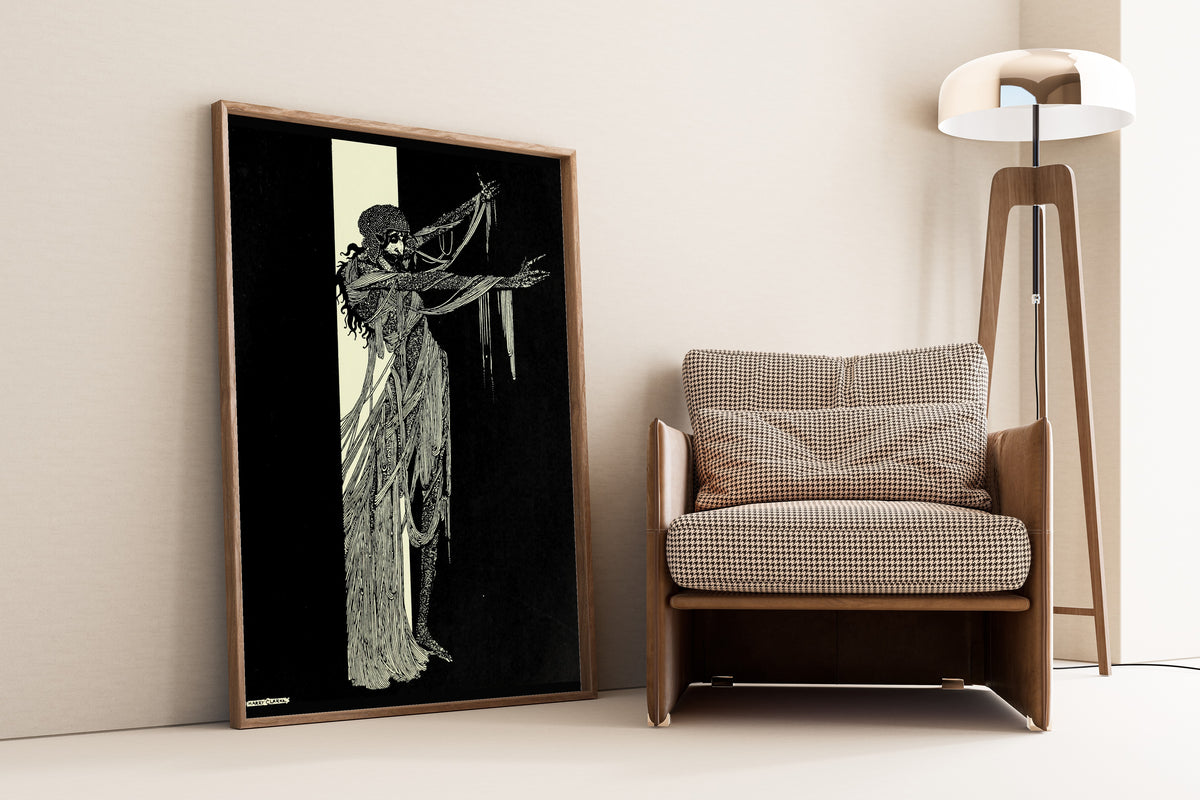Framed art print of Tales of Mystery and Imagination: The Lady Madeline of Usher by Harry Clarke, leaning against a wall beside an armchair and a floor lamp