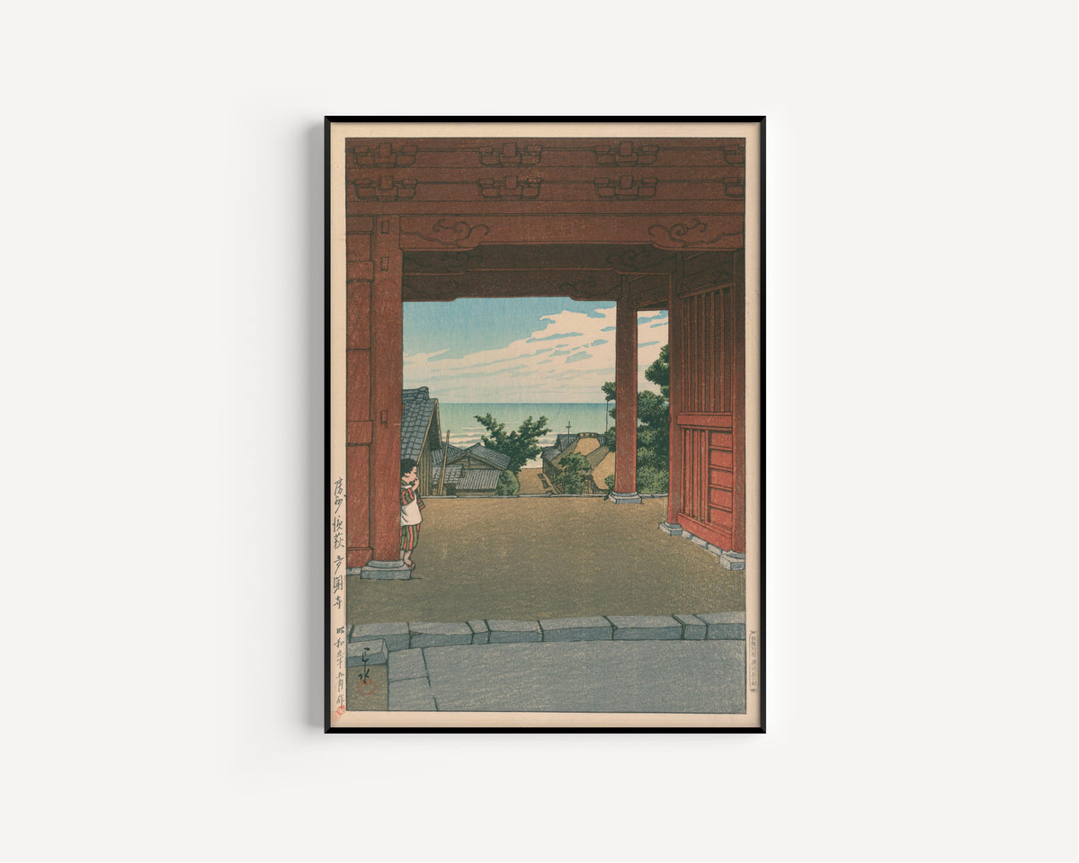 Framed art print of Tamon Temple at Hamahagi, Awa Province by Kawase Hasui, in a slim black frame on a plain white wall