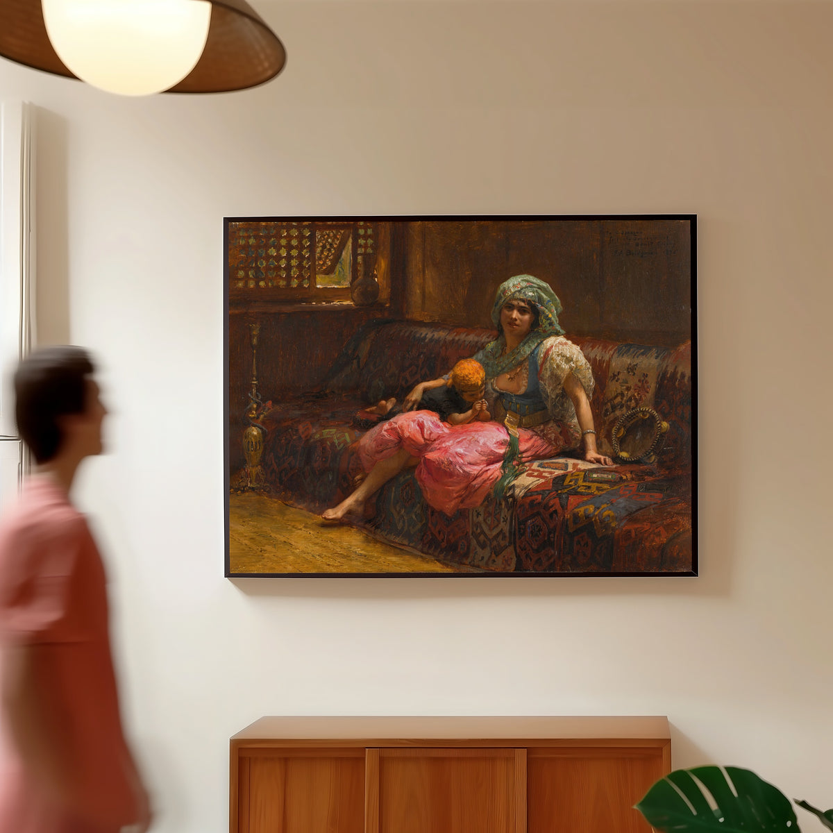 Framed art print of Tender Moments by Frederick Arthur Bridgman, in a slim black frame on a warm wall in a sunlit room