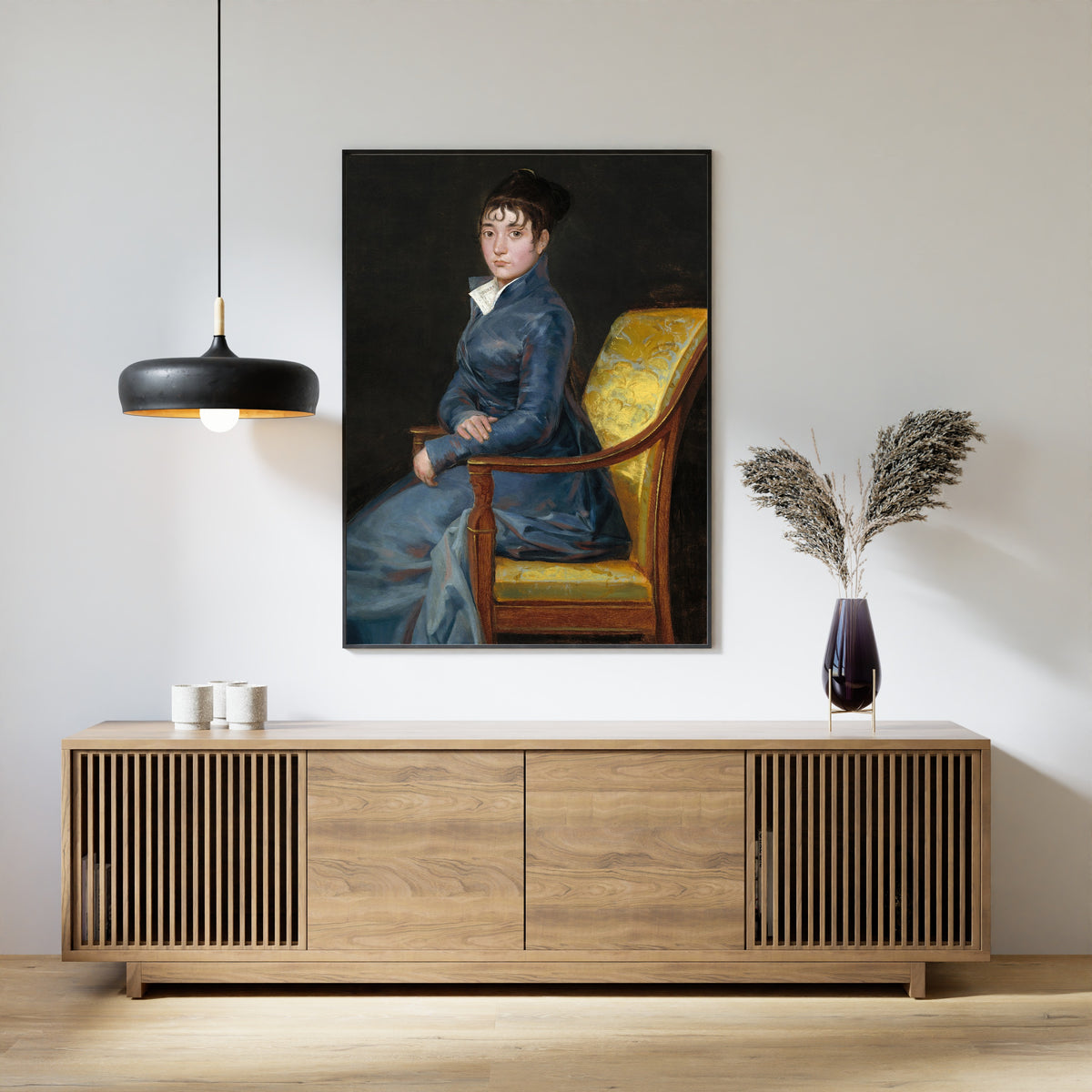 Framed art print of Thérèse Louise de Sureda by Francisco de Goya, above a slatted wood sideboard