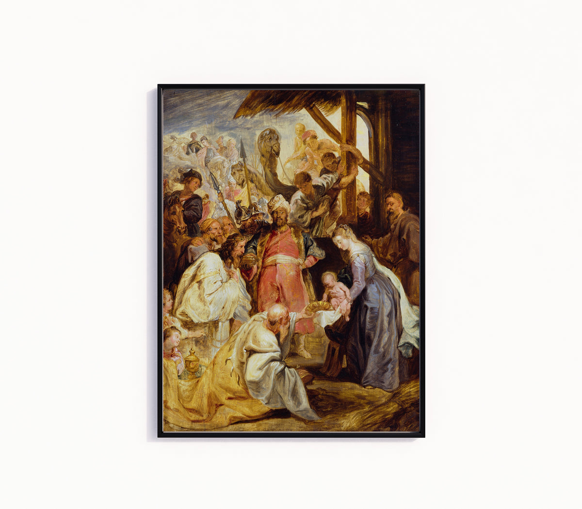 Framed art print of The Adoration of the Magi by Peter Paul Rubens, in a slim black frame on a plain white wall